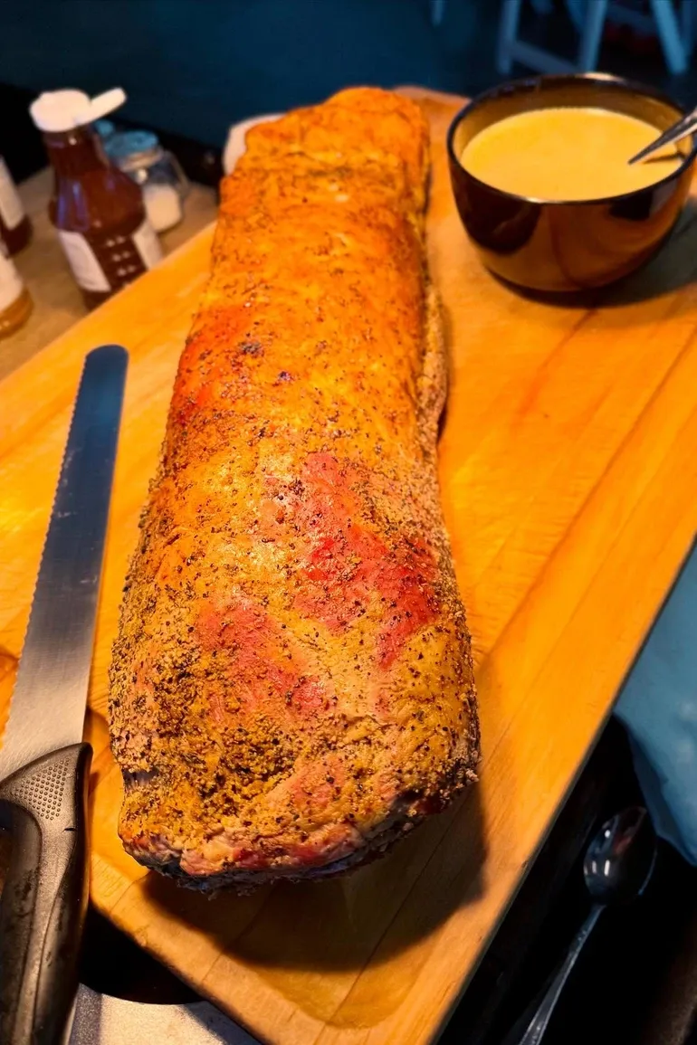 Whole smoked loin resting on a cutting board